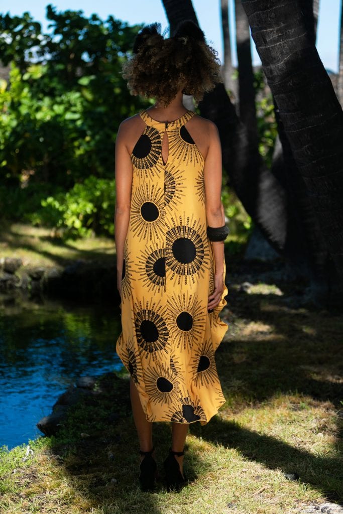 Female model wearing Kawehilani Dress in Kanehoalani Pattern - Back View