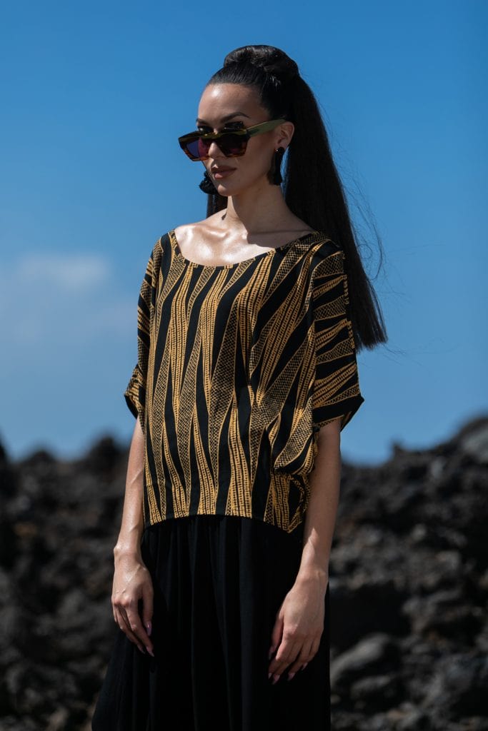 Female model wearing 3/4 Sleeve Shirt in Gold and Black - Front View