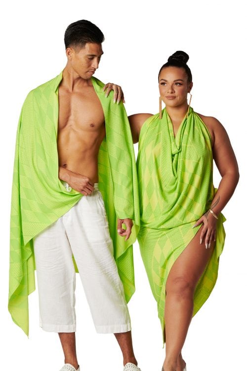 Female and male model wearing a Pareo in Kamehameha print and wild lime color - Front View