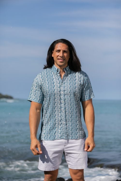 Male model wearing Aloha Short Sleeve in a Lei Kupee Print and Real Teal/Tofu Color - Front View