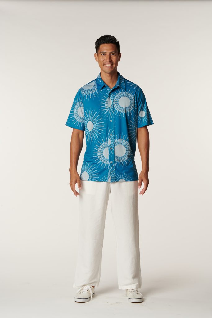Male model wearing Aloha on The Green Pullover in a Kanehoalani Print and Seaport/Illusion Color - Front View