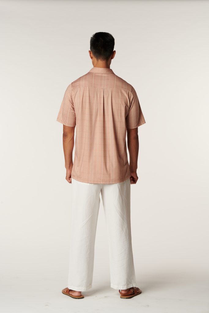 Male model wearing Aloha on The Green Pullover in a Kapa Print and Sandshell/Macaroon Color - Back View