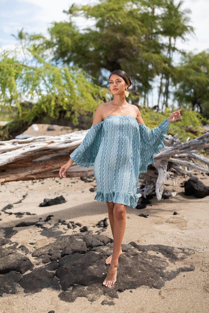 Female model wearing Leinani Dress in Lei Kupee Print and Blue Tint/Real Teal Color - Front View