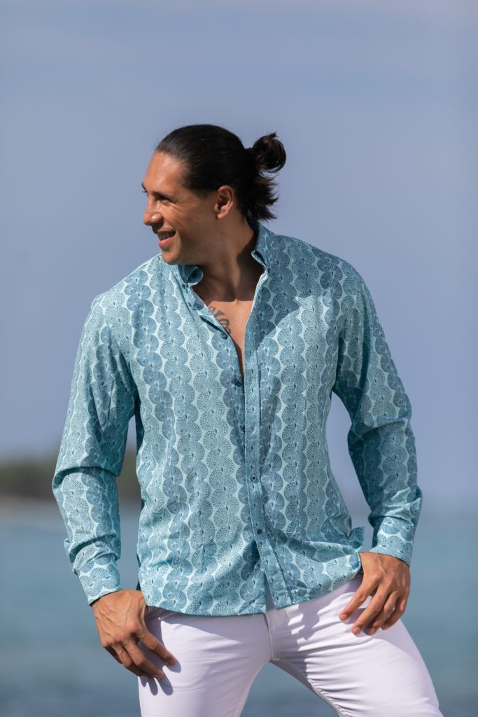 Male model wearing Mahalo Shirt L-S in a Lei Kupee Print and Blue Tint/Real Teal Color - Front View