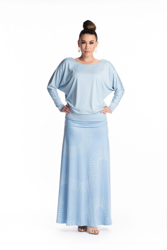 Female model wearing Kanoe Top in Light Blue - Front View