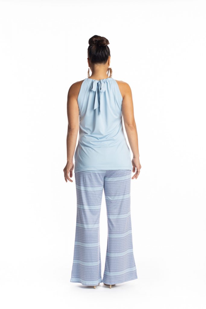 Female model wearing Nanu Top in Light Blue - Back View
