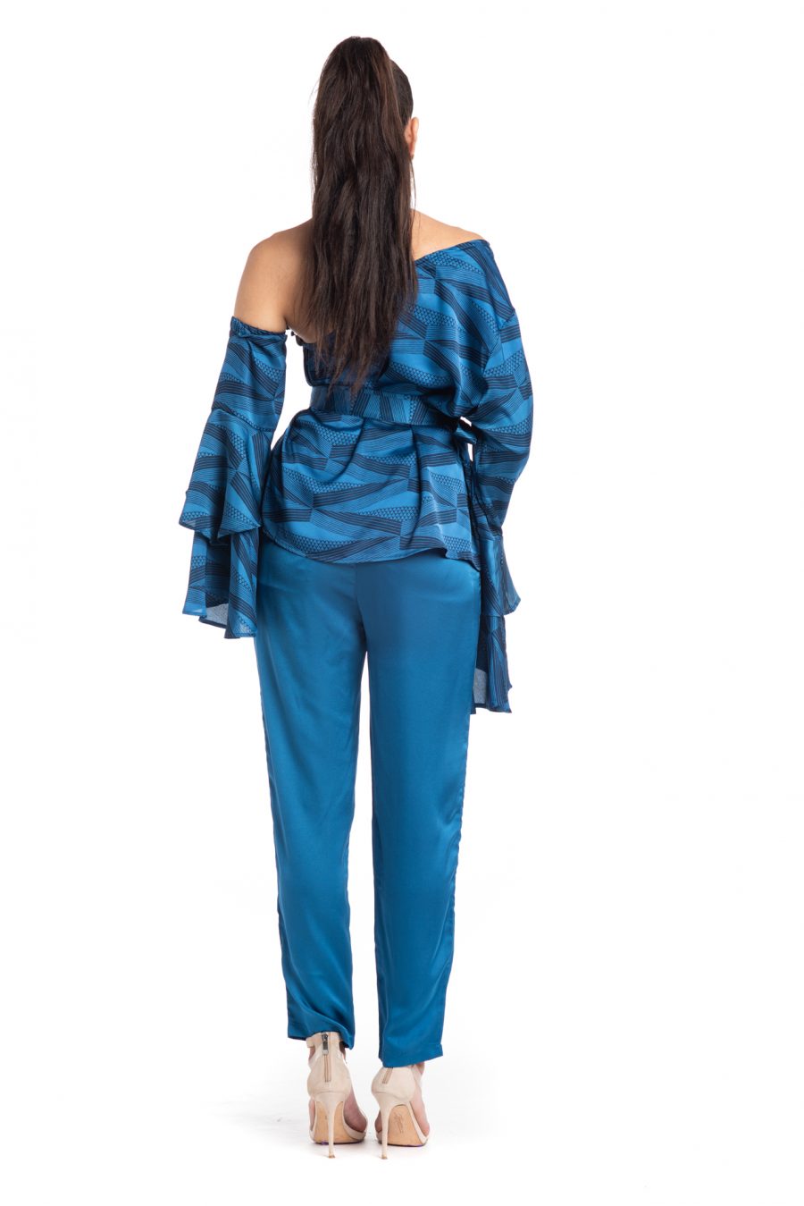 Female model wearing Uluhala Joggers in a Solid Print and Blue/Sapphire Color - Back View