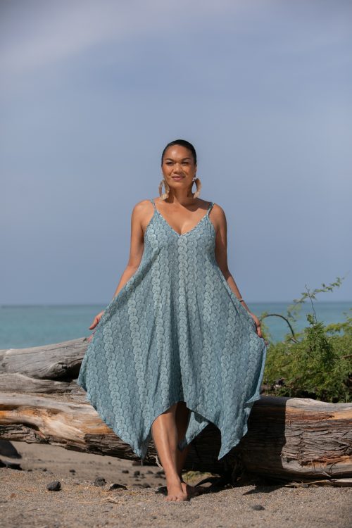 Female model wearing a Pualahilahi Dress in Lei Kupee Print and Real Teal/Blue Tint Color - Front View