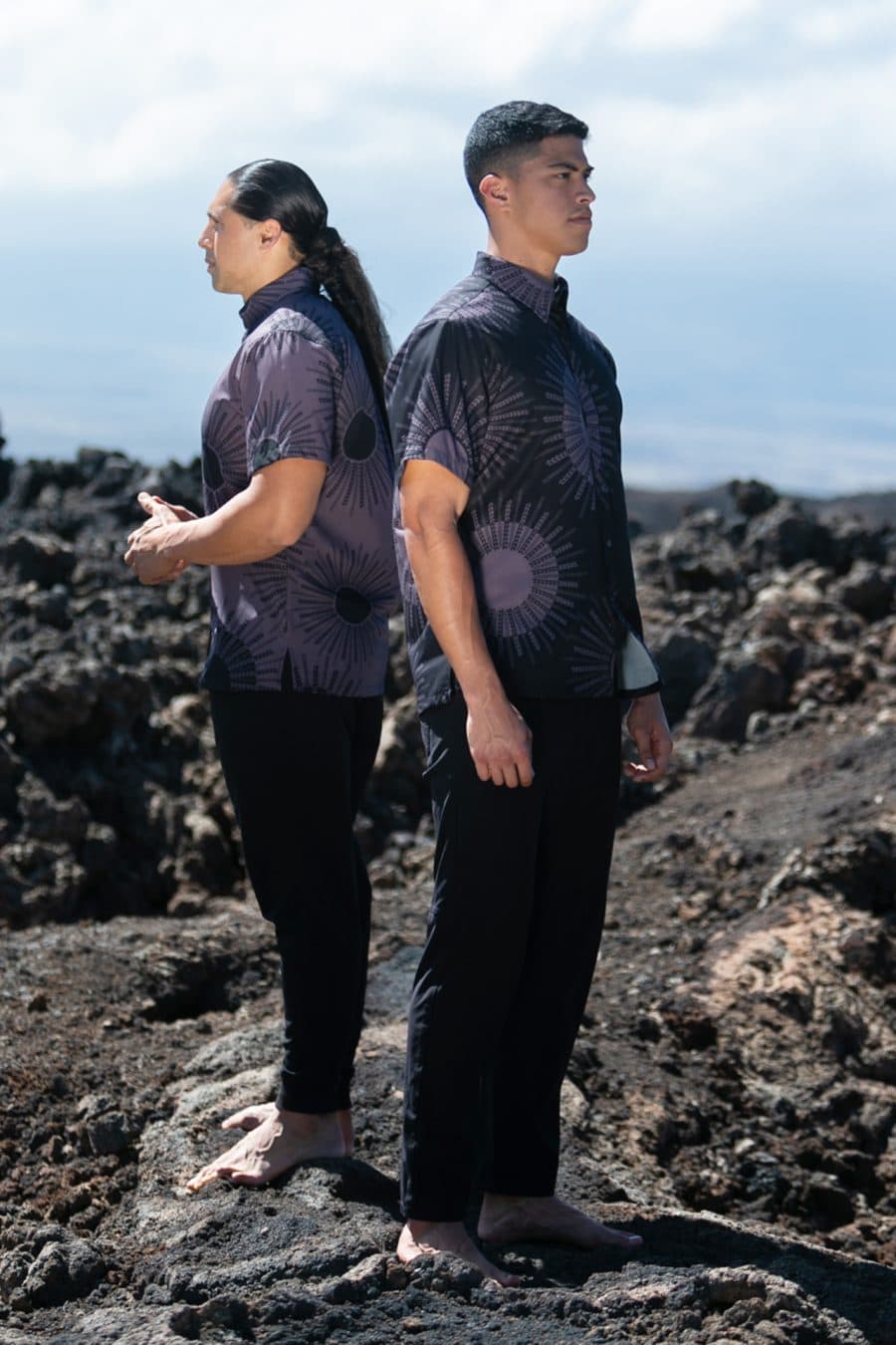 Male model wearing Mahalo Shirt S-S in Kaneholani pattern and Black-Blackened Pearl Color - Side View