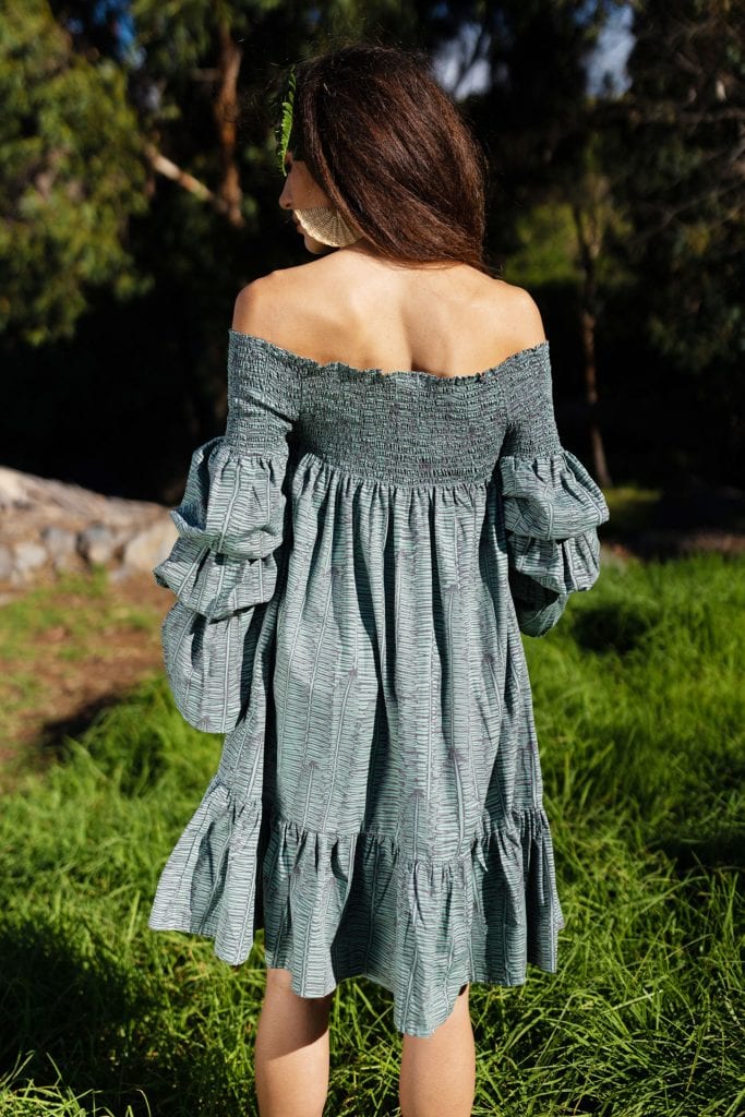 Female model wearing Kawena Dress in Kupukupu Pattern - Back View