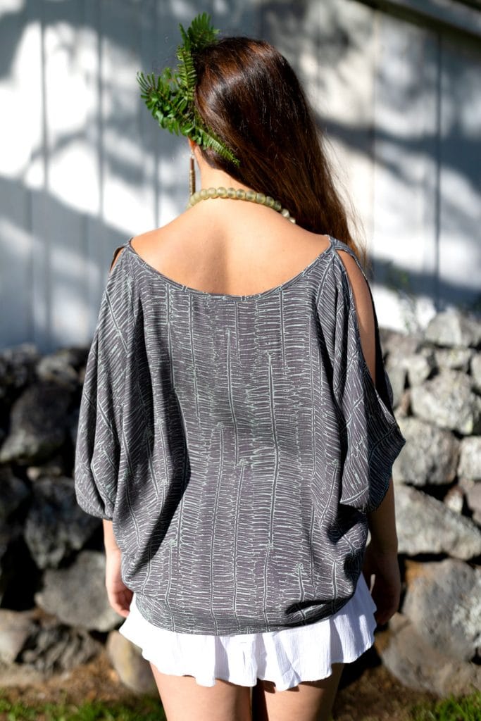 Female Model wearing Top in Kupukupu Pattern - Back View