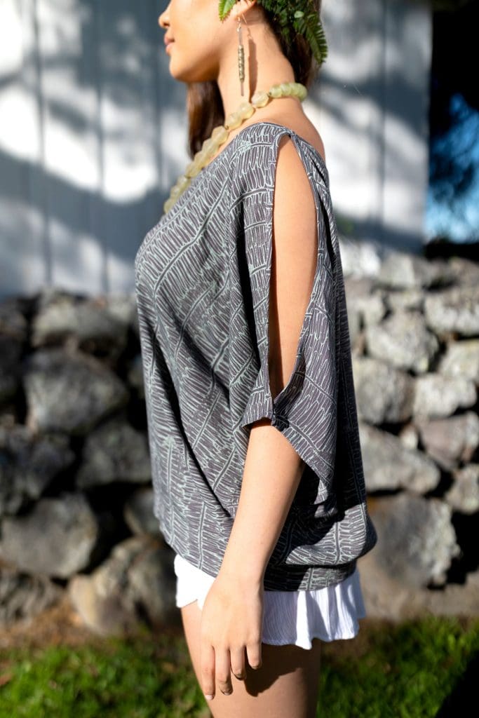 Female Model wearing Top in Kupukupu Pattern - Side View