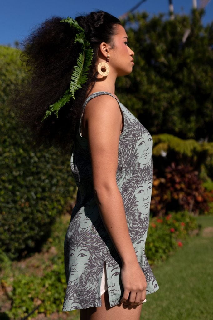 Female model wearing Malama Top - Side View