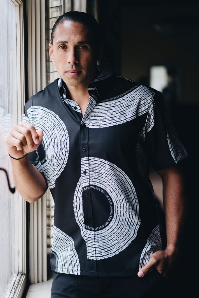 Male model wearing Mahalo Shirt S-S in Blk/White and Poai Pattern