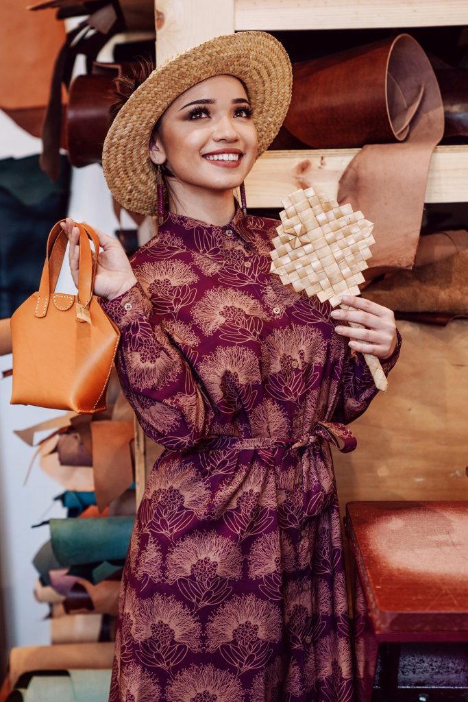 Female model wearing Keao Dress in Purple Potion, Lion, and Kalihilehua Pattern